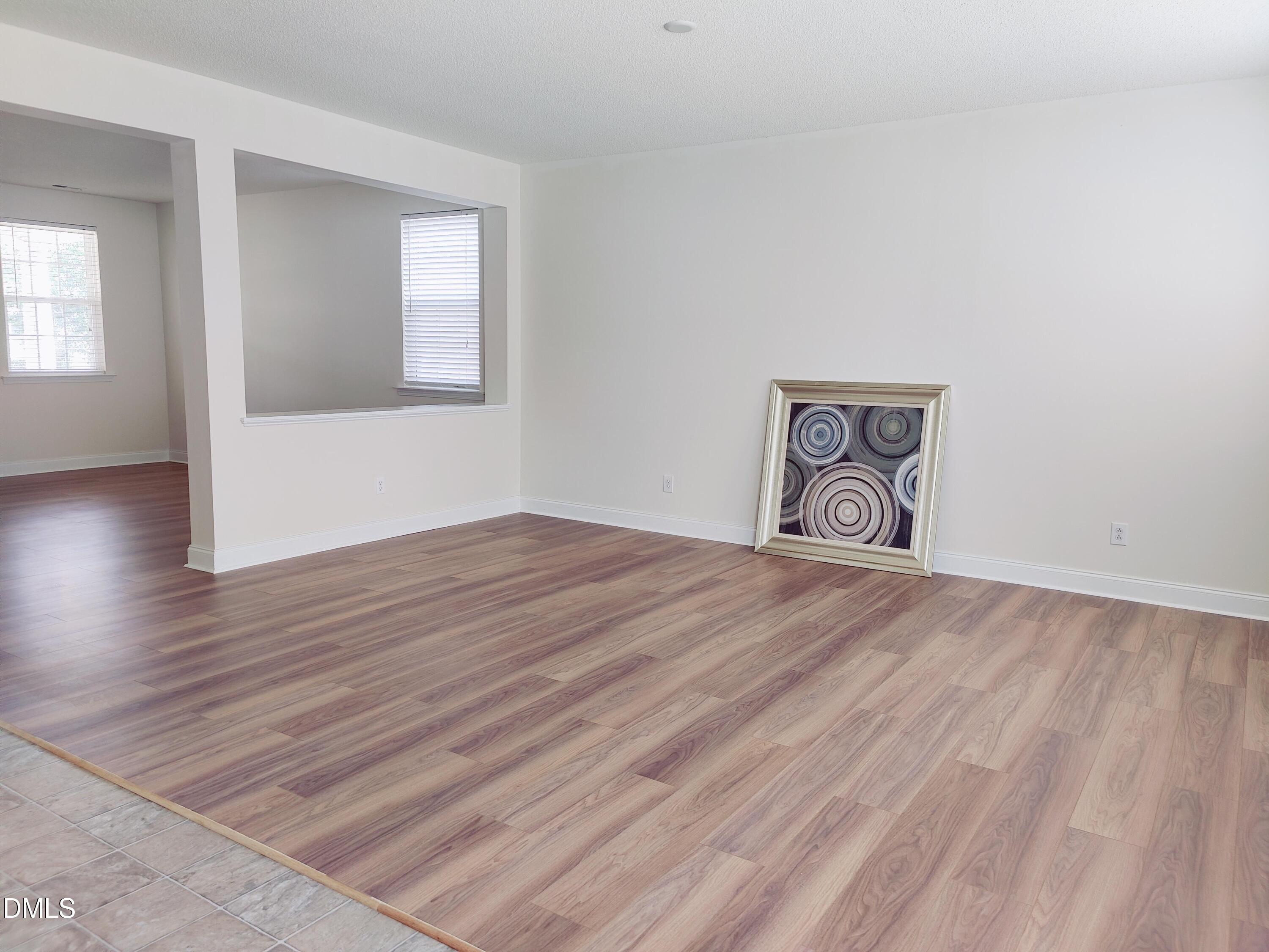 4011 Oatgrass Lane Raleigh, NC 27604 - Photo 6 of 21 a view of a room with wooden floor