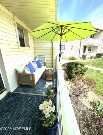 a view of a two chairs in the patio