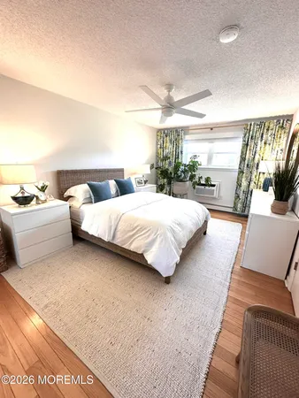 a bedroom with bed and window