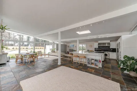 a view of a dining area with furniture window and outside view