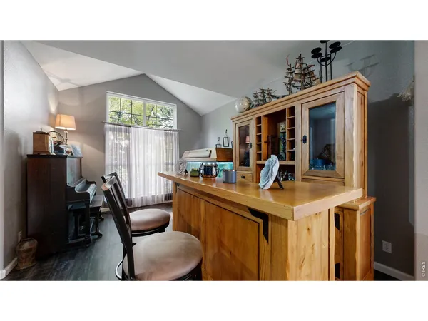 a kitchen with a dining table and chairs
