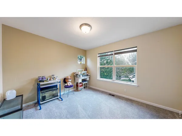 a room with furniture and a window