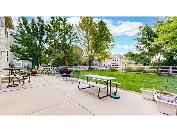 a house view with a sitting space garden and patio