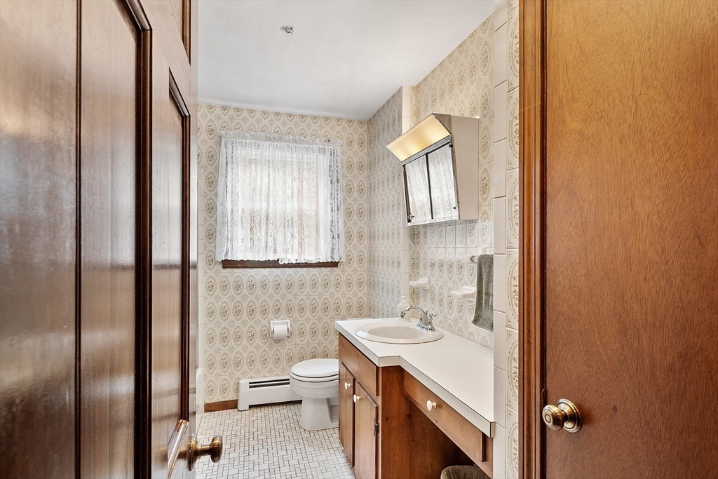6 Ingalls Road Tyngsborough, MA 01879 - Photo 13 of 38 a bathroom with a sink toilet and shower