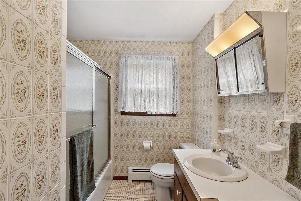 6 Ingalls Road Tyngsborough, MA 01879 - Photo 14 of 38 a bathroom with a sink toilet and shower