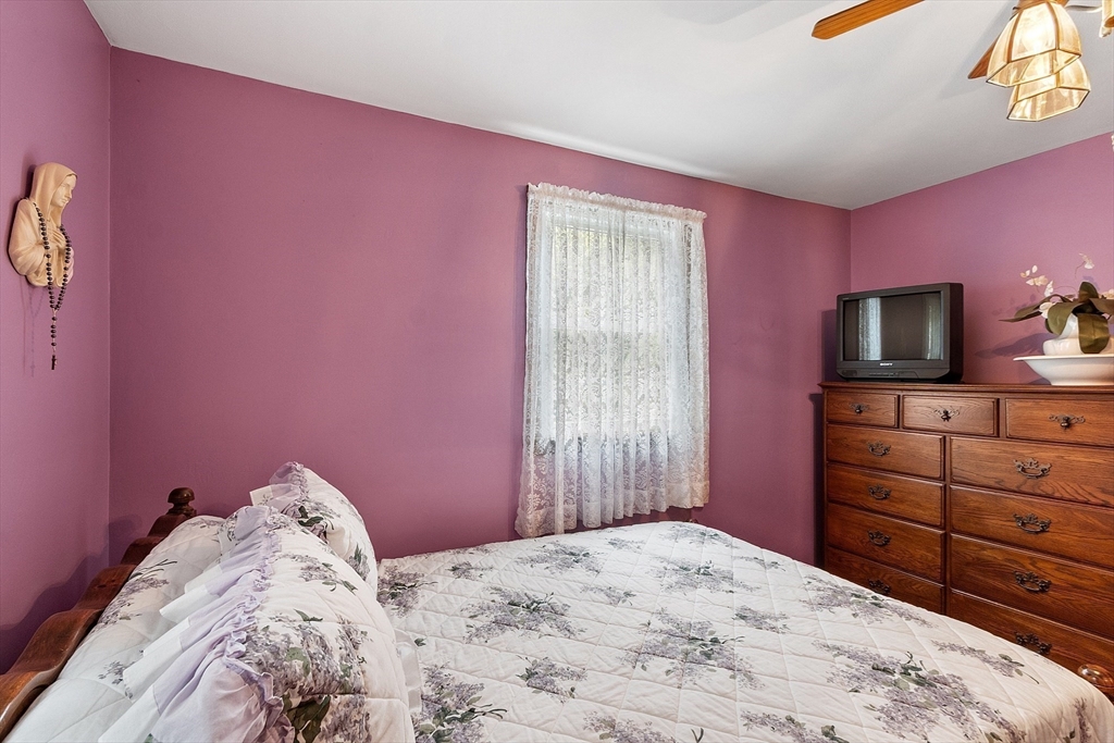6 Ingalls Road Tyngsborough, MA 01879 - Photo 16 of 38 a bedroom with a bed and a television