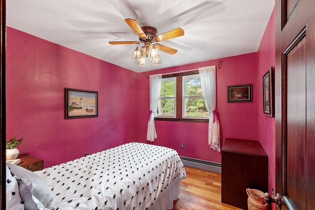 6 Ingalls Road Tyngsborough, MA 01879 - Photo 17 of 38 a bedroom with a bed and a chandelier