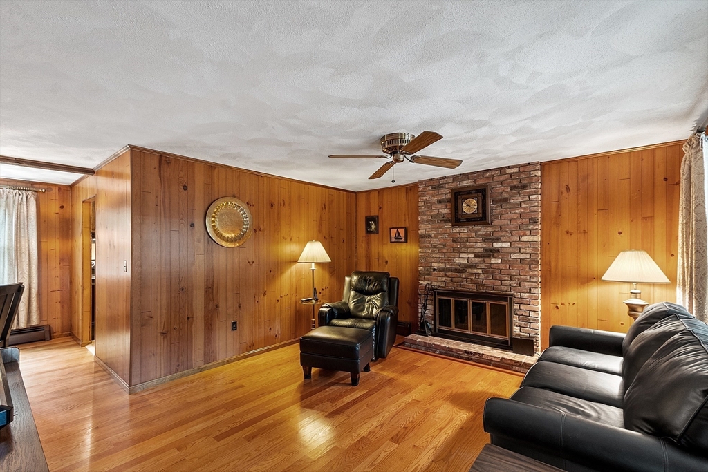 6 Ingalls Road Tyngsborough, MA 01879 - Photo 2 of 38 a living room with furniture and a fireplace