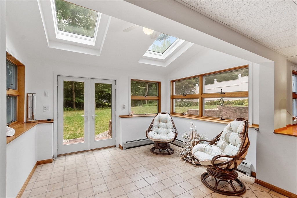 6 Ingalls Road Tyngsborough, MA 01879 - Photo 25 of 38 a living room filled with furniture and large windows