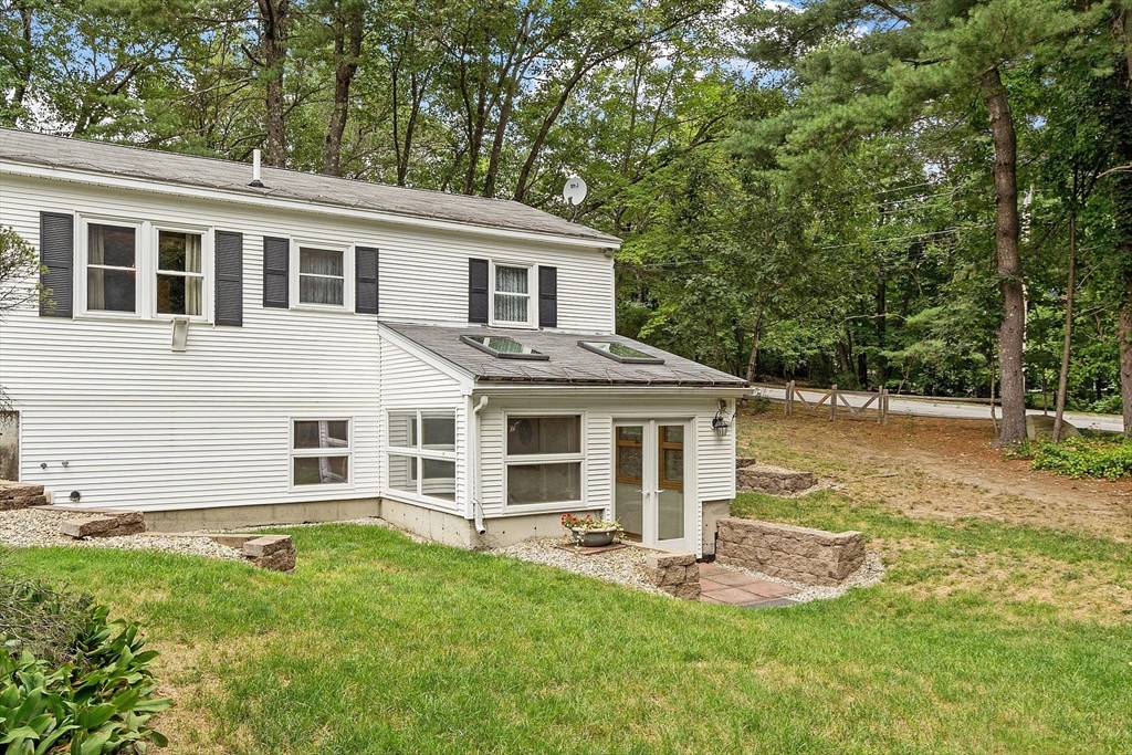6 Ingalls Road Tyngsborough, MA 01879 - Photo 27 of 38 a front view of a house with a yard