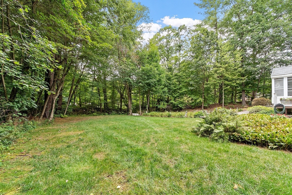 6 Ingalls Road Tyngsborough, MA 01879 - Photo 29 of 38 a backyard of a house with lots of green space