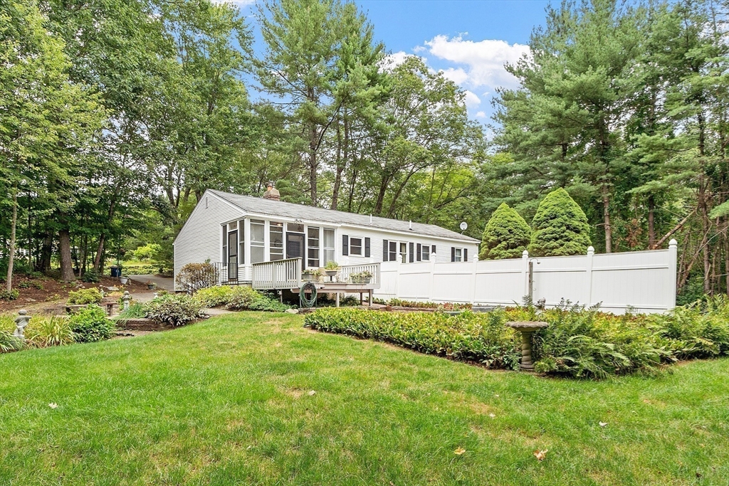 6 Ingalls Road Tyngsborough, MA 01879 - Photo 30 of 38 a house that is sitting in the grass