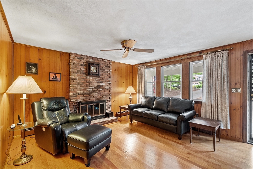 6 Ingalls Road Tyngsborough, MA 01879 - Photo 3 of 38 a living room with furniture and a fireplace