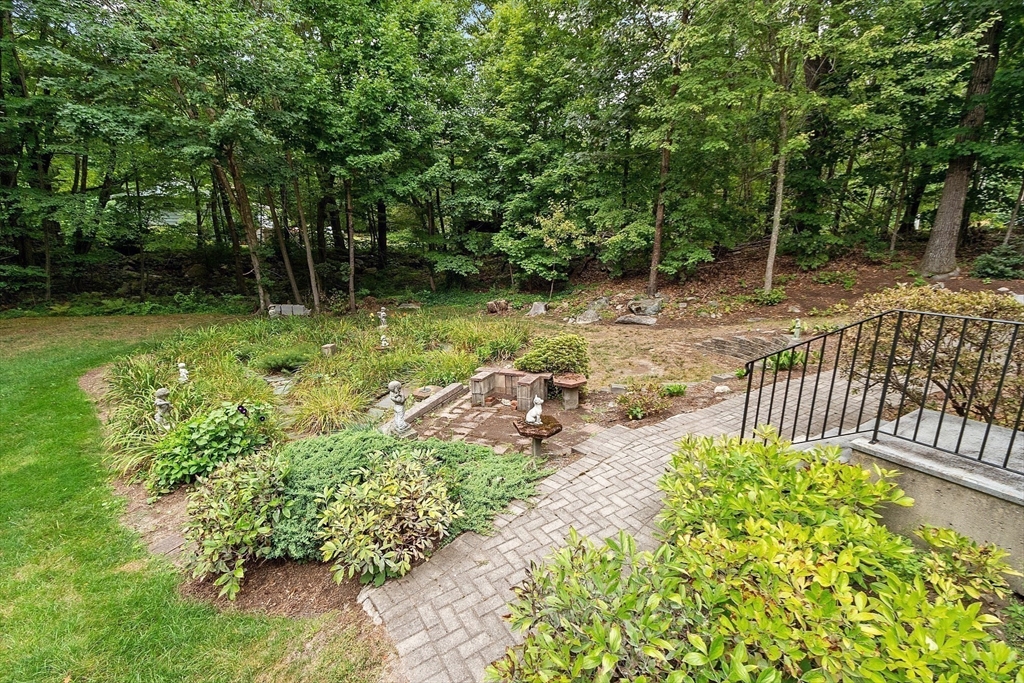 6 Ingalls Road Tyngsborough, MA 01879 - Photo 34 of 38 a garden view with a chair