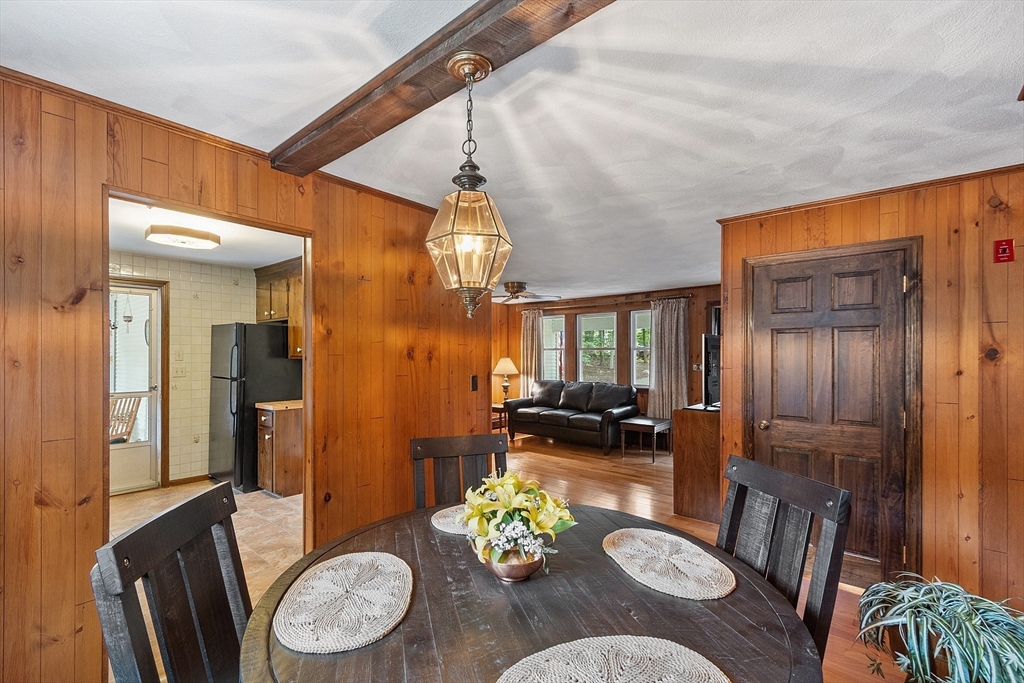 6 Ingalls Road Tyngsborough, MA 01879 - Photo 7 of 38 a view of a dining room with furniture a chandelier and wooden floor