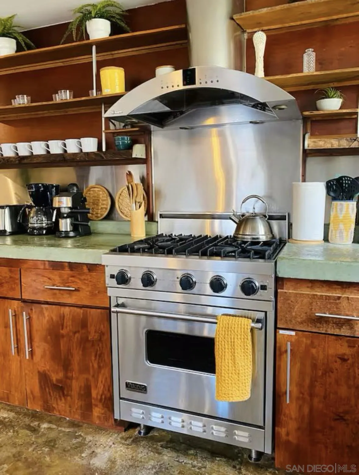 513 3rd Street Encinitas, CA 92024 - Photo 12 of 22 a stove top oven sitting inside of a kitchen