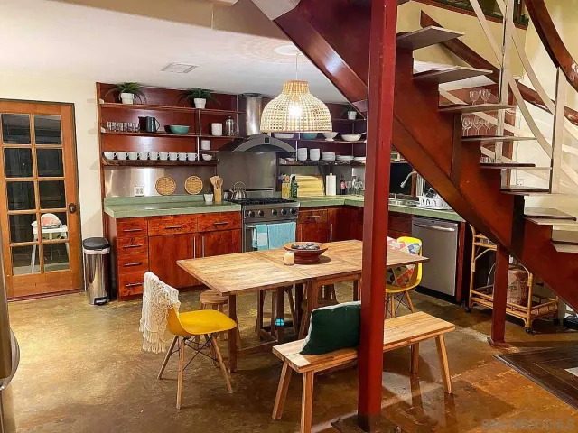 a dining room with a table and chairs