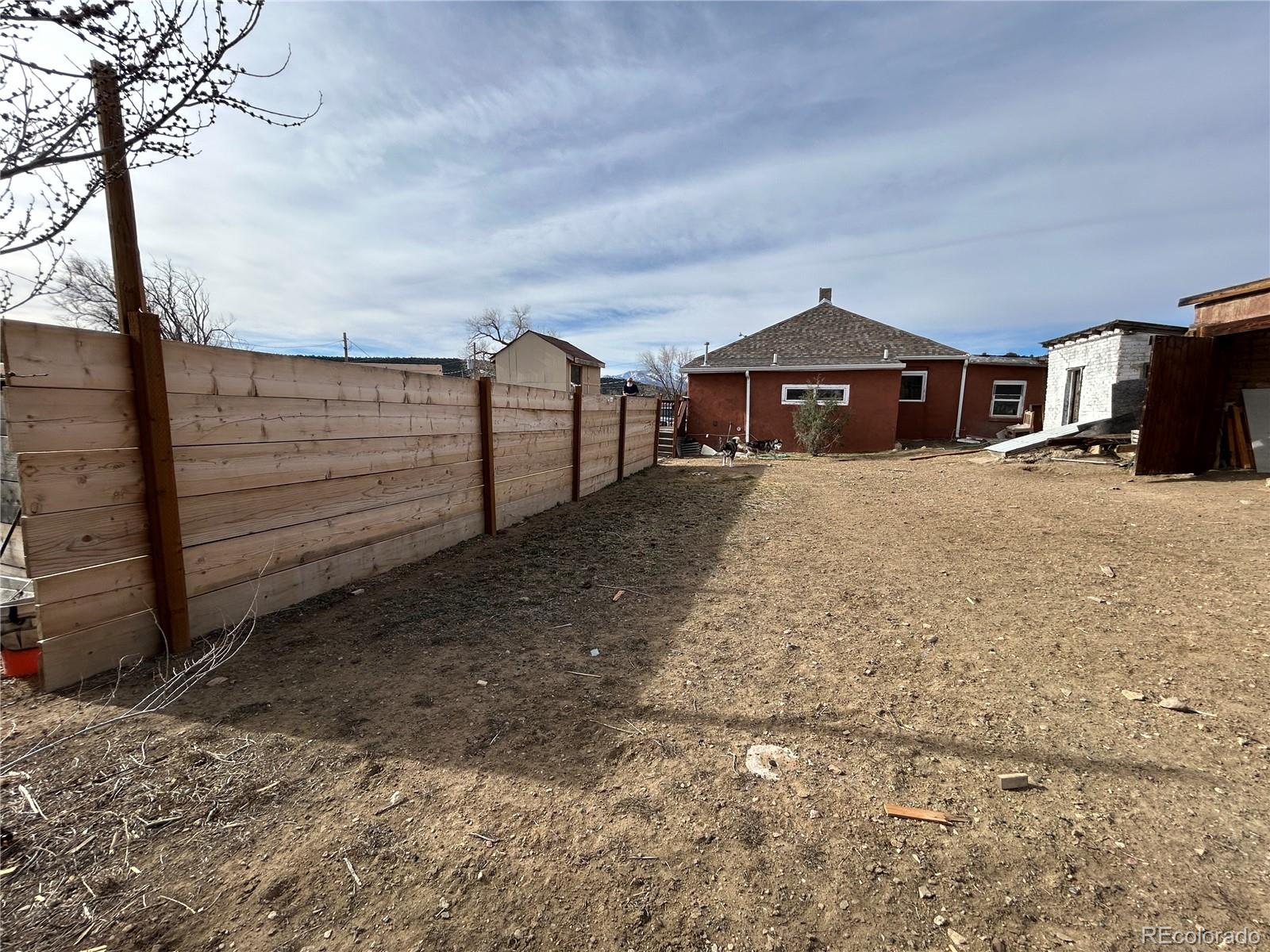 26 West 3rd Street Walsenburg, CO 81089 - Photo 22 of 27 a view of a house with a yard