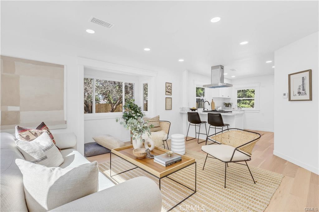 a living room with furniture and a table
