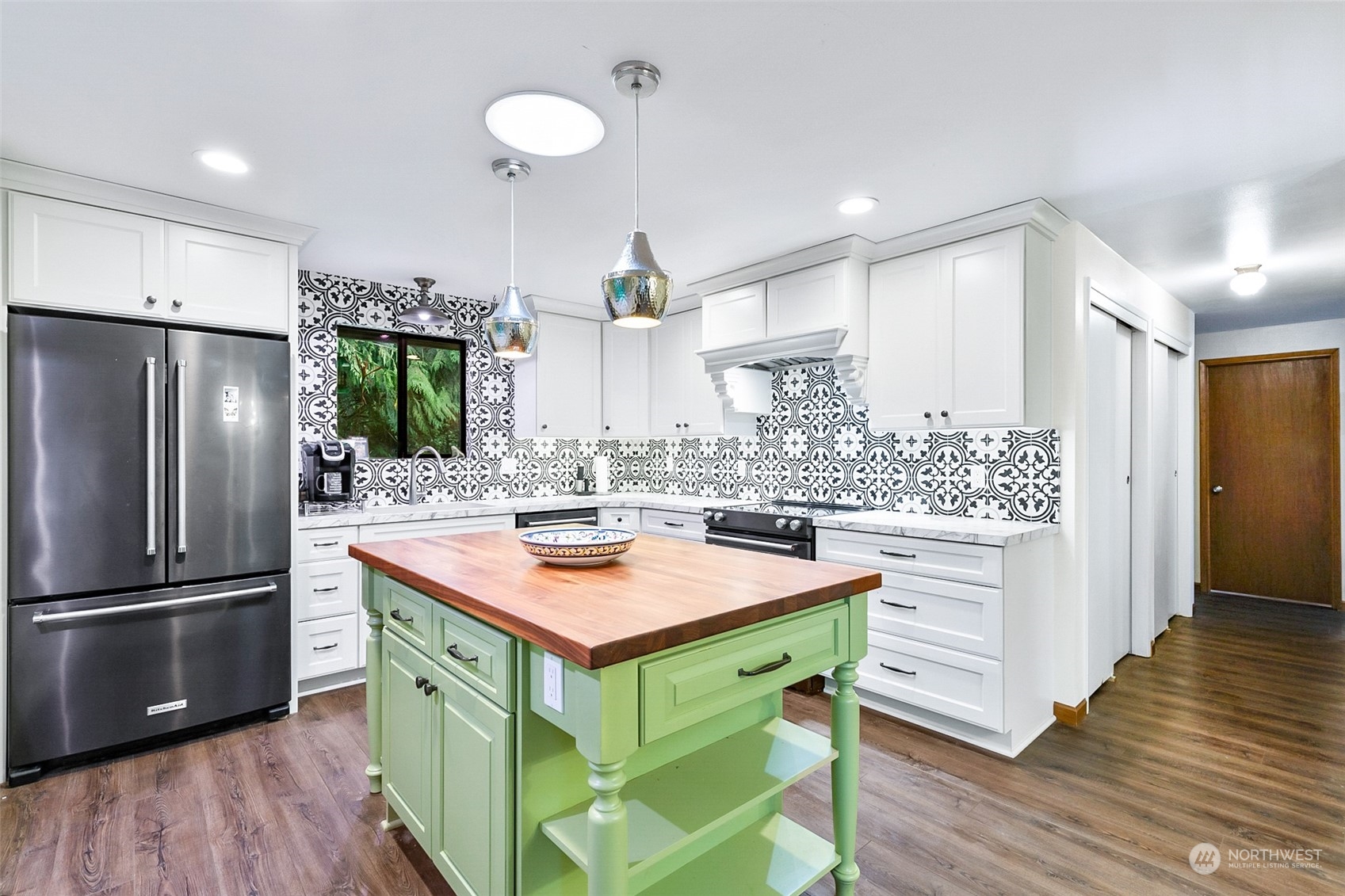 4848 Sharpe Road Anacortes, WA 98221 - Photo 11 of 33 a kitchen with stainless steel appliances granite countertop a sink stove and refrigerator