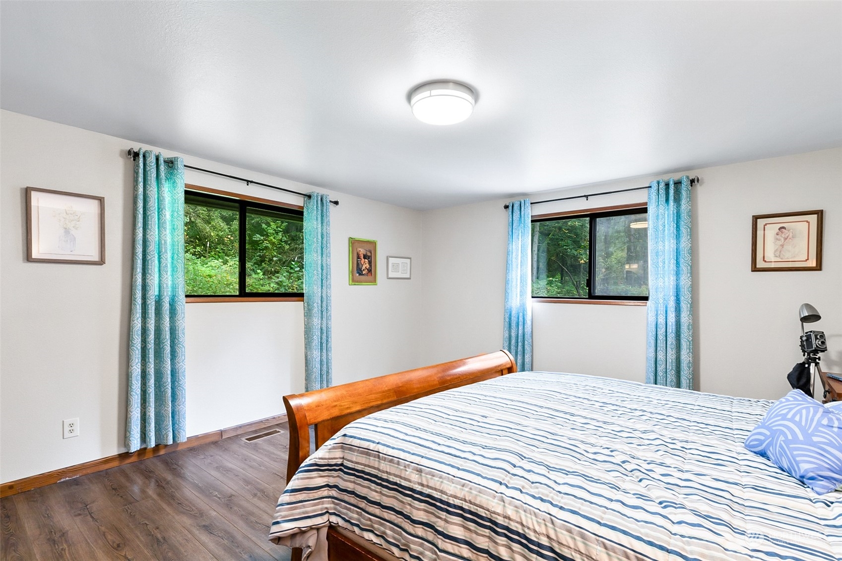 4848 Sharpe Road Anacortes, WA 98221 - Photo 14 of 33 a bedroom with wooden floor and window
