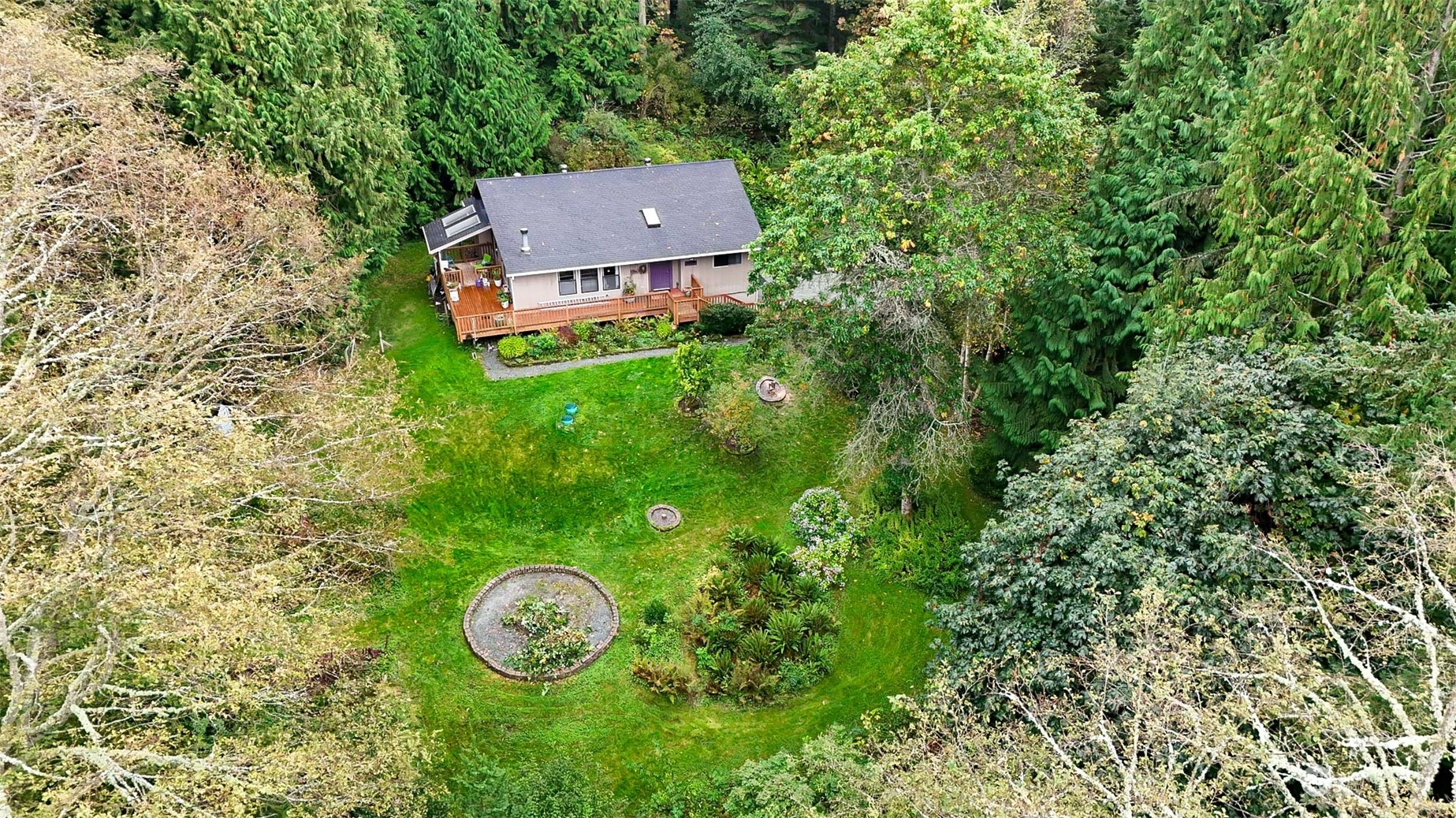 4848 Sharpe Road Anacortes, WA 98221 - Photo 27 of 33 an aerial view of a house with a yard and garden