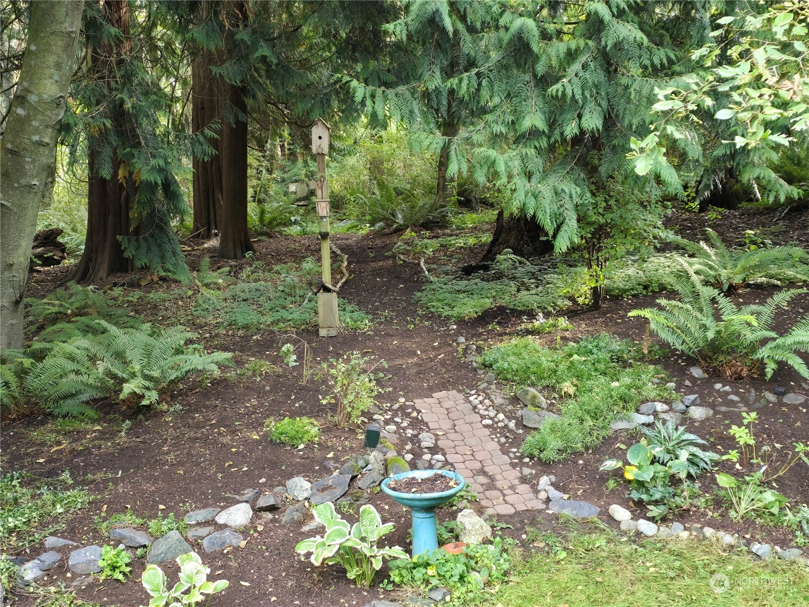 4848 Sharpe Road Anacortes, WA 98221 - Photo 29 of 33 a view of a garden with fire pit
