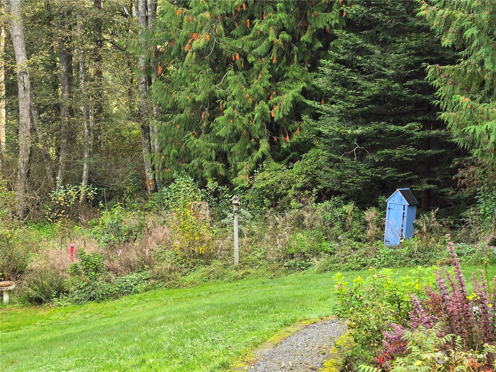 4848 Sharpe Road Anacortes, WA 98221 - Photo 33 of 33 a view of a house with a yard