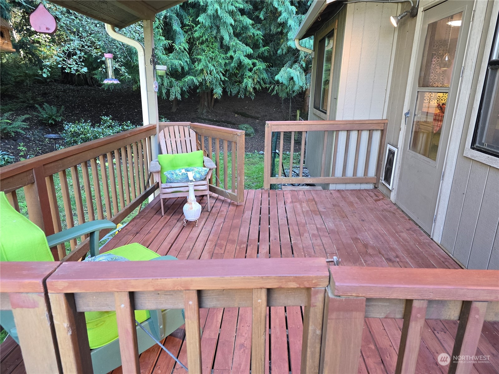 4848 Sharpe Road Anacortes, WA 98221 - Photo 8 of 33 a view of balcony with wooden floor outdoor seating and yard in back