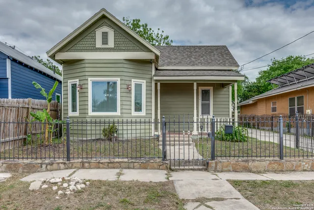 a front view of a house with glass outdoor