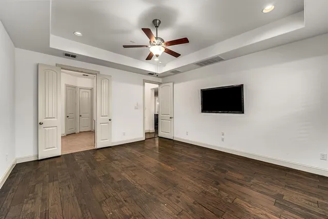 a kitchen with stainless steel appliances granite countertop wooden floors and stove