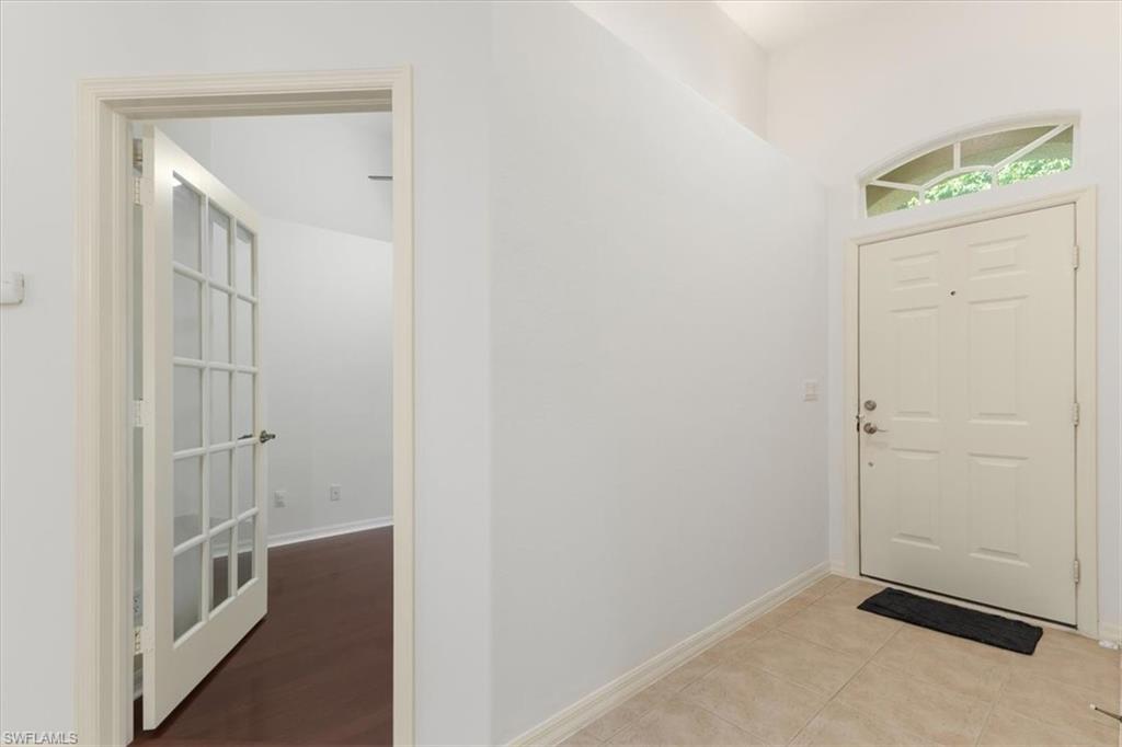 15073 Cortona Way Naples, FL 34120 - Photo 13 of 35 a view of a hallway with elevator