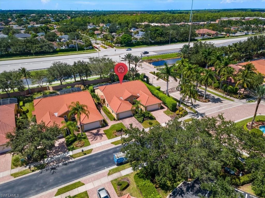 15073 Cortona Way Naples, FL 34120 - Photo 24 of 35 an aerial view of tennis court