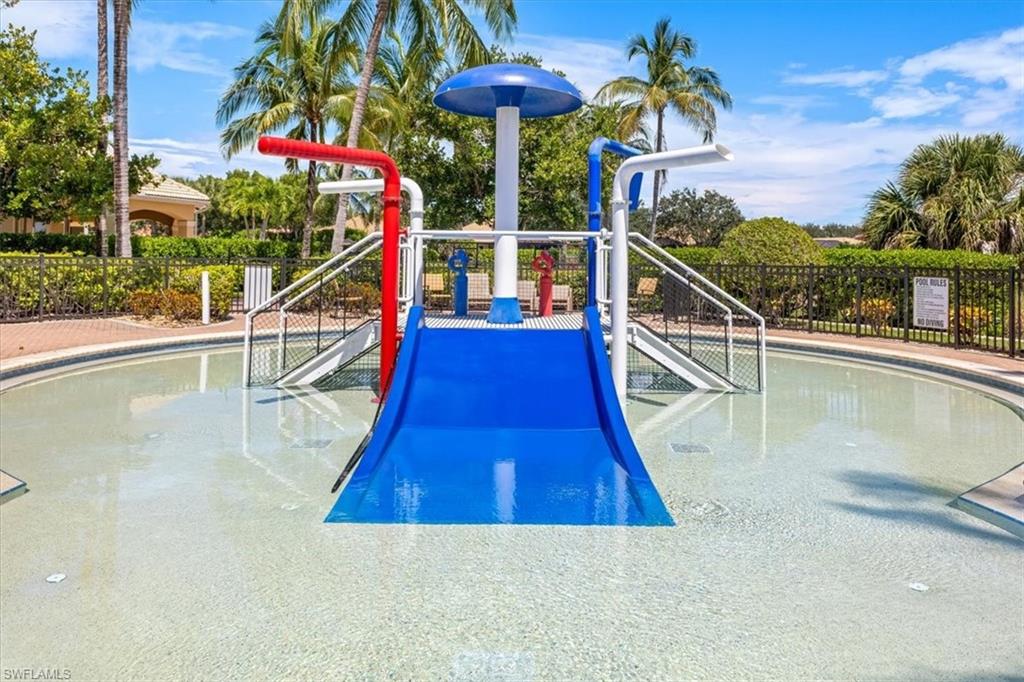 15073 Cortona Way Naples, FL 34120 - Photo 29 of 35 a view of a swimming pool with a patio