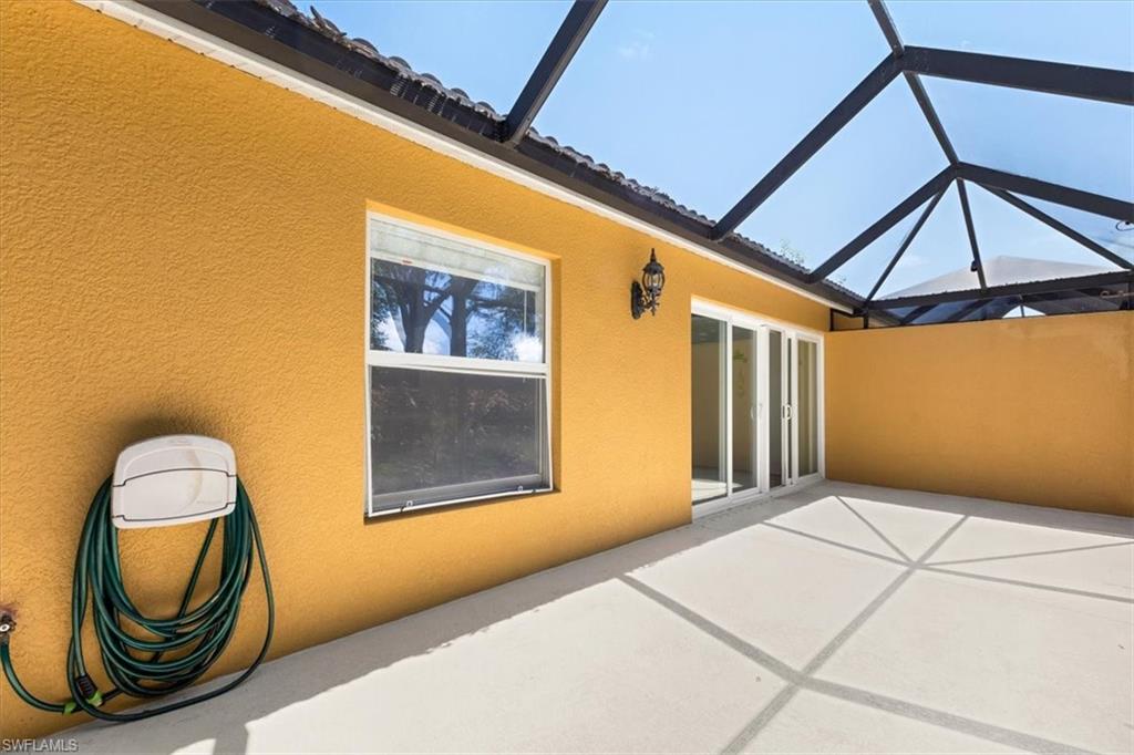 15073 Cortona Way Naples, FL 34120 - Photo 32 of 35 a front view of a house with entryway