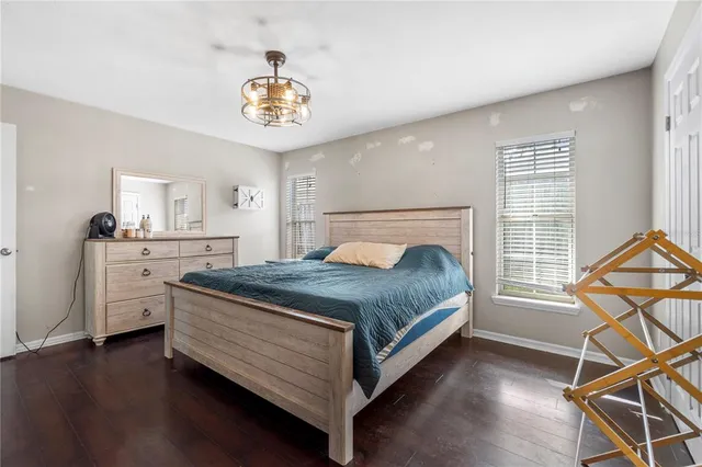 a bedroom with a bed and dresser