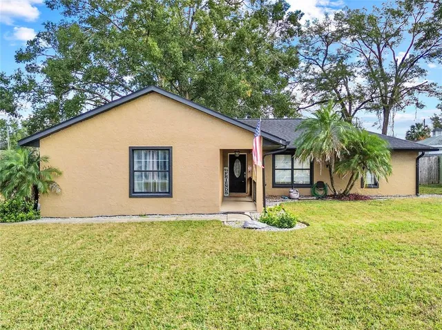 a house with trees in front of it
