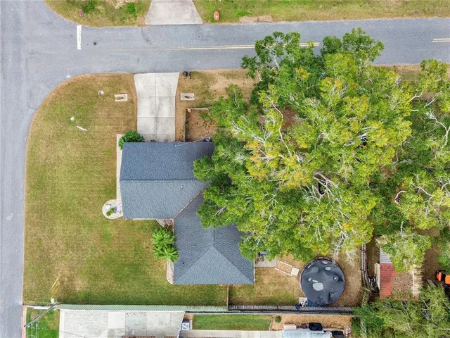 an aerial view of a house with swimming pool