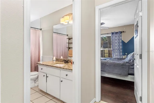 a en suite bathroom with a sink a mirror and a shower