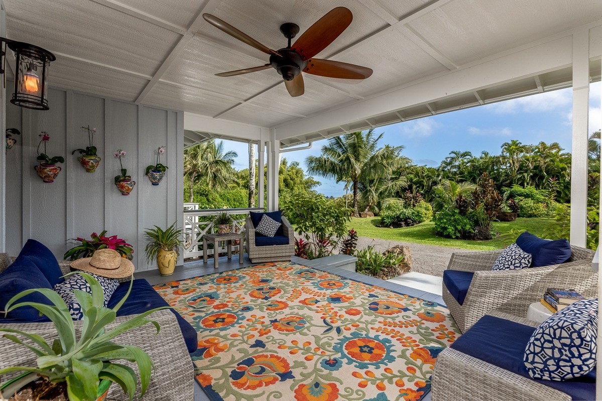 7475 E Koolau Road, Unit D Kilauea, HI 96754 - Photo 12 of 30 a living room with patio furniture and a potted plant