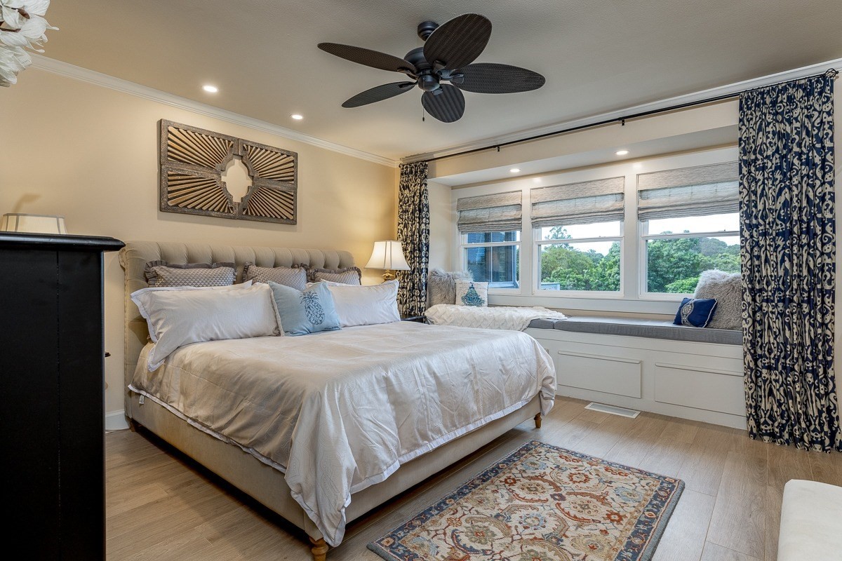 7475 E Koolau Road, Unit D Kilauea, HI 96754 - Photo 17 of 30 a bedroom with a large bed and a large window
