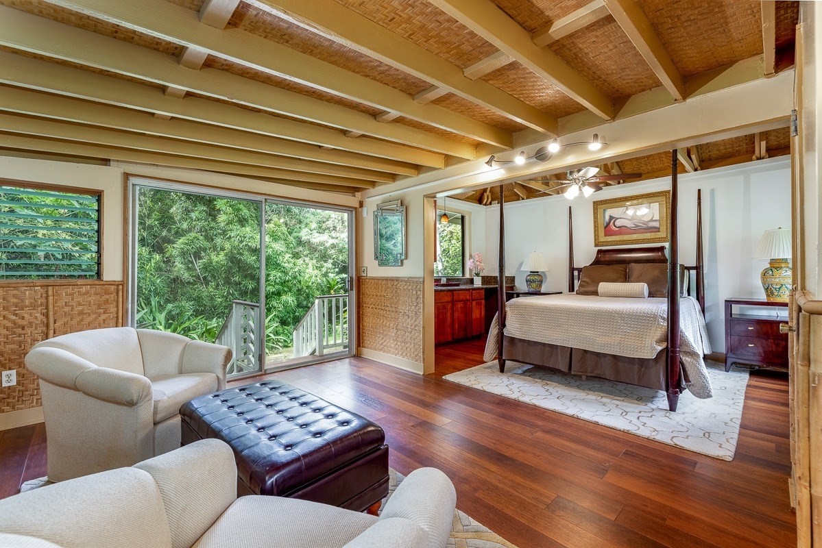 7475 E Koolau Road, Unit D Kilauea, HI 96754 - Photo 27 of 30 a bedroom with furniture and a large window