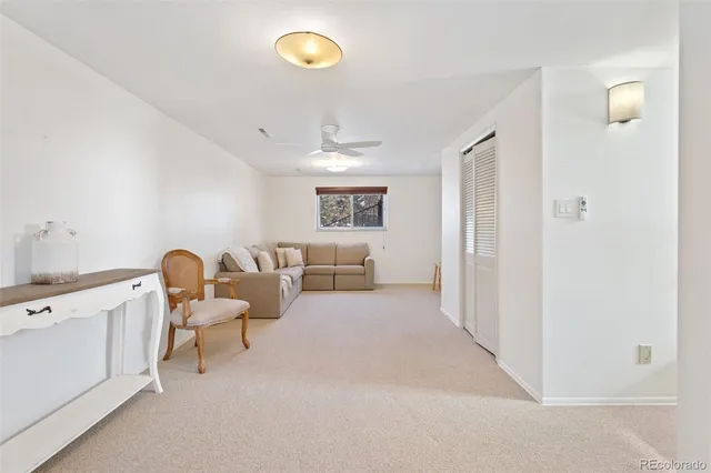a view of a house with a yard covered in snow