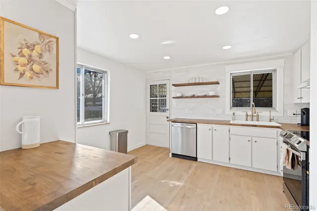 a bathroom with a sink mirror and toilet