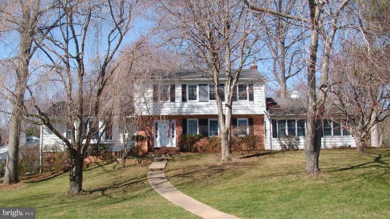 245 Providence Road Annapolis, MD 21409 - Photo 1 of 27 a front view of a building with a yard