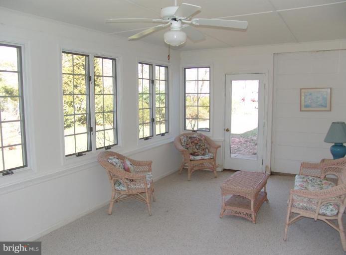 245 Providence Road Annapolis, MD 21409 - Photo 12 of 27 a living room with furniture and two windows