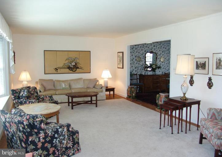 245 Providence Road Annapolis, MD 21409 - Photo 4 of 27 a living room with furniture and a fireplace