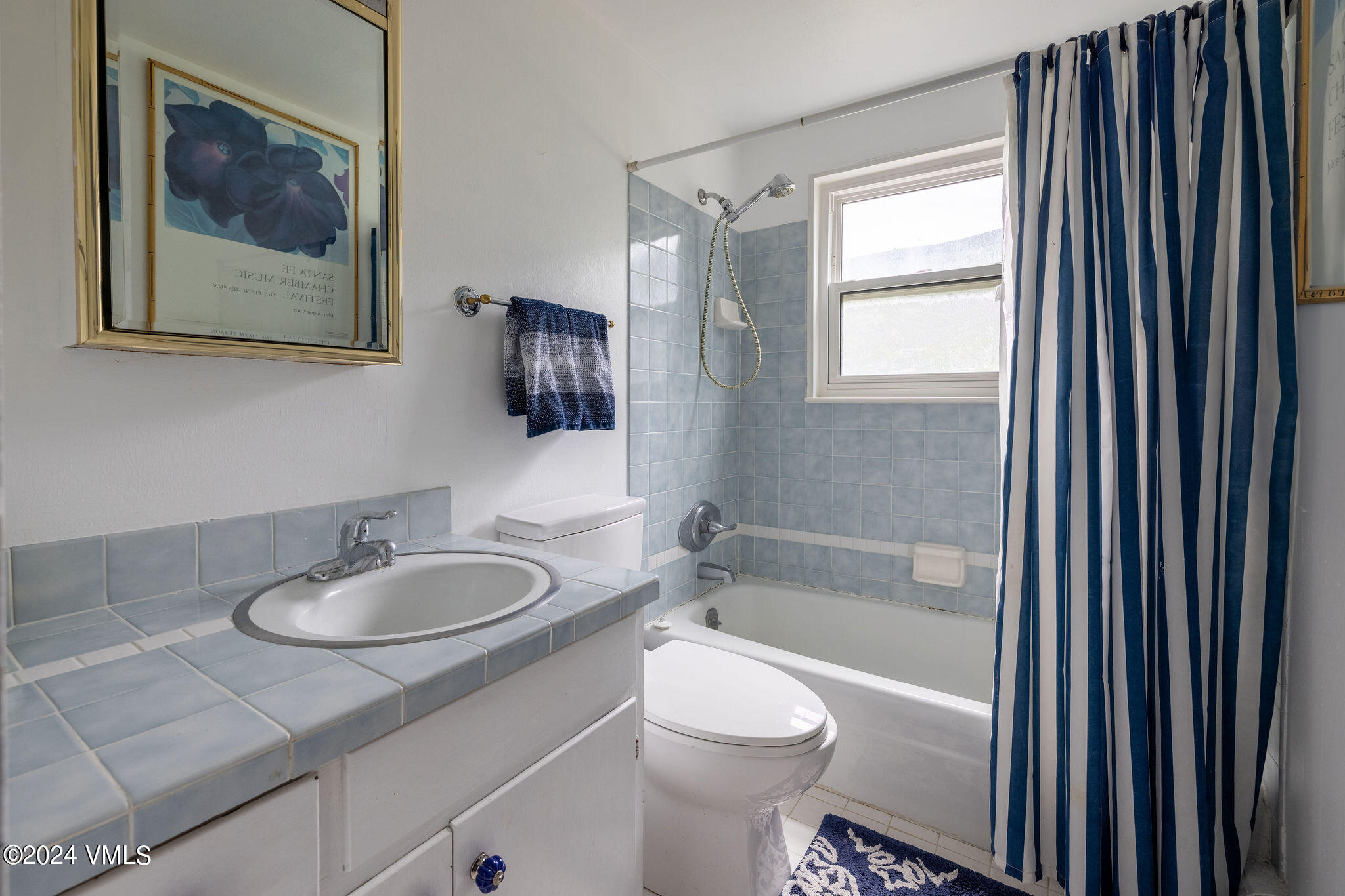 2456 Chamonix Lane, Unit B2 Vail, CO 81657 - Photo 11 of 18 a bathroom with a granite countertop sink toilet and shower