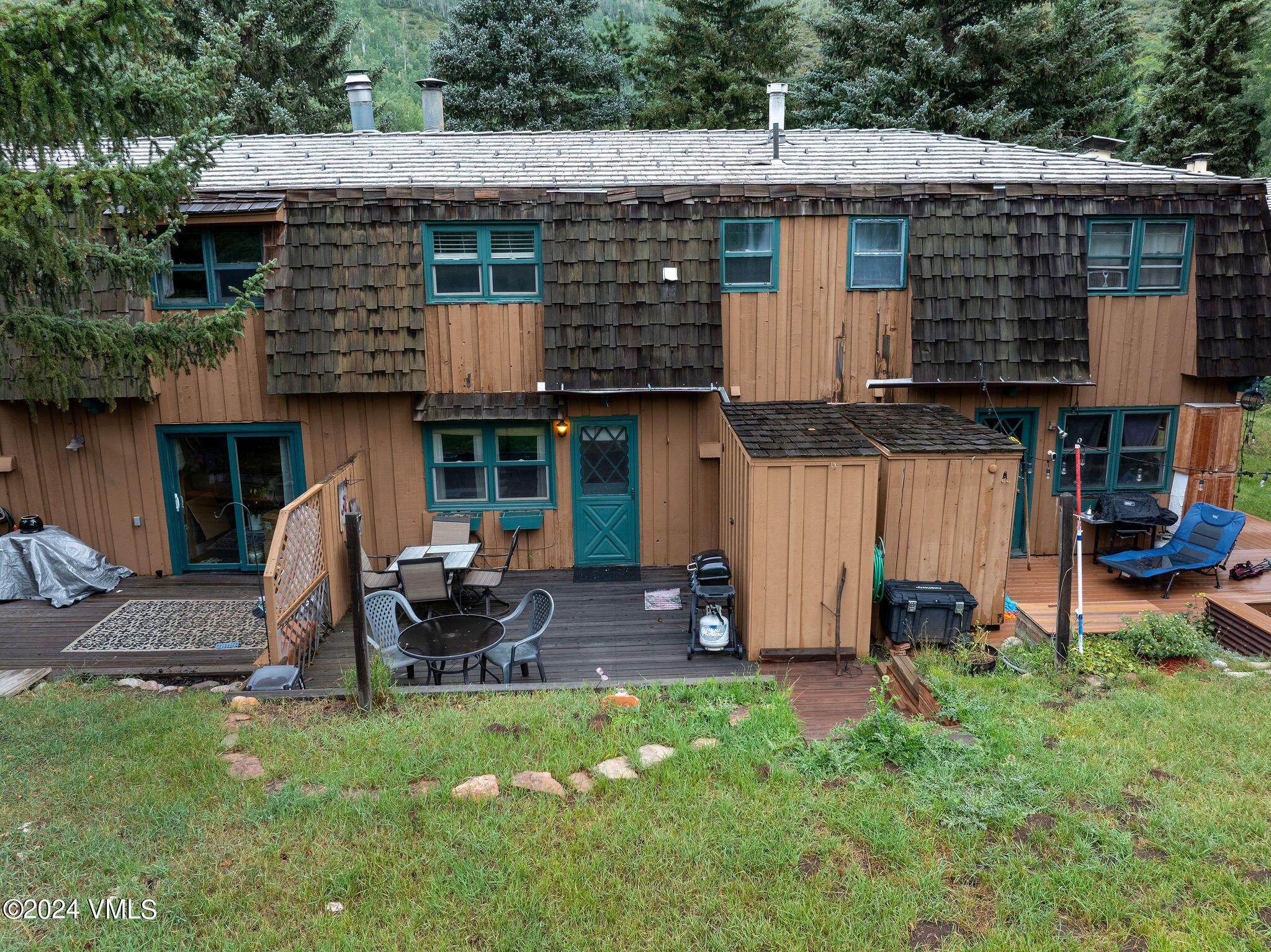 2456 Chamonix Lane, Unit B2 Vail, CO 81657 - Photo 13 of 18 a view of a house with backyard tub and chair