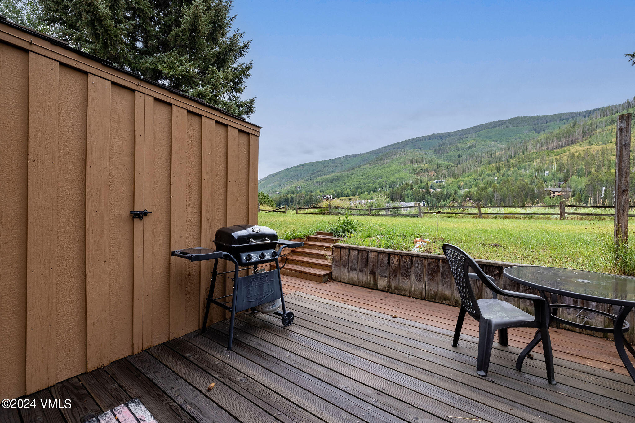 2456 Chamonix Lane, Unit B2 Vail, CO 81657 - Photo 16 of 18 a view of a chairs and table on the terrace